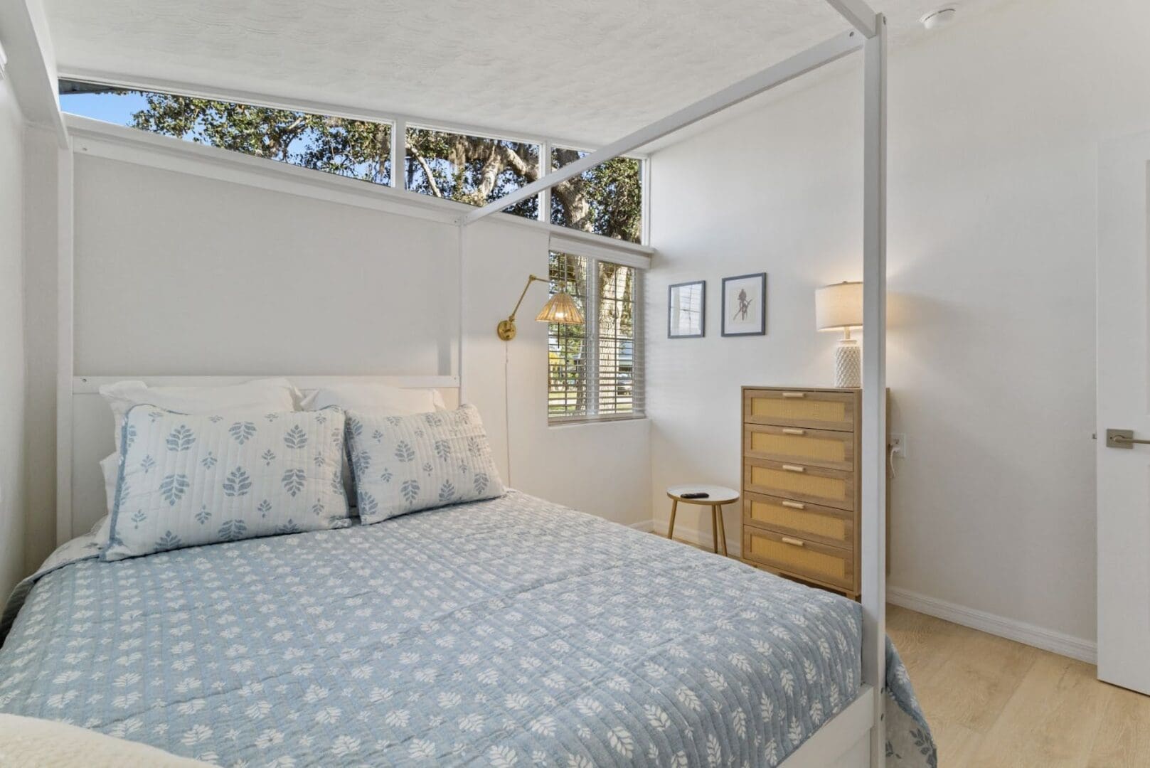 Cozy bedroom with modern decor and natural light.